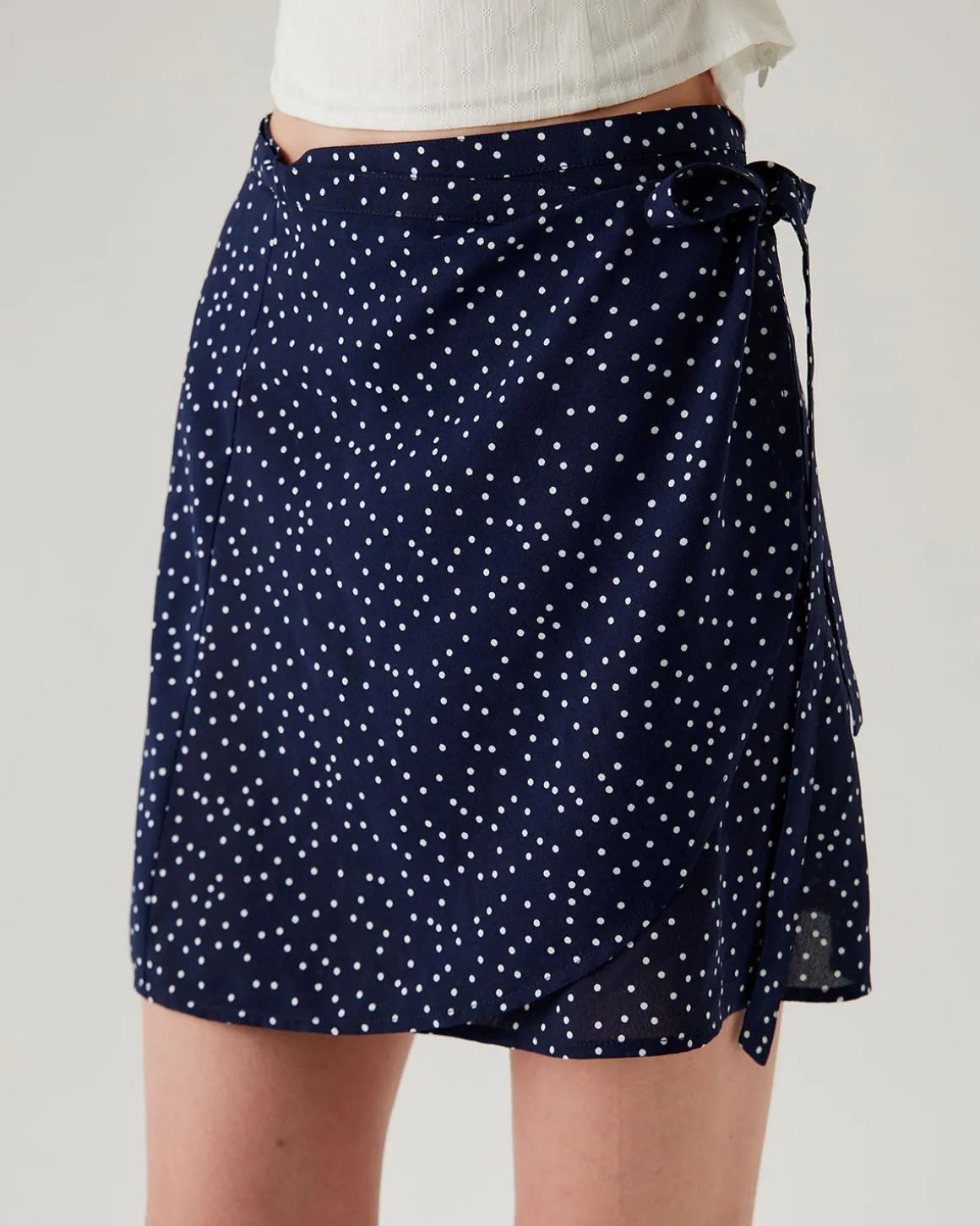 Navy Polka Dot Wrap Mini Skirt